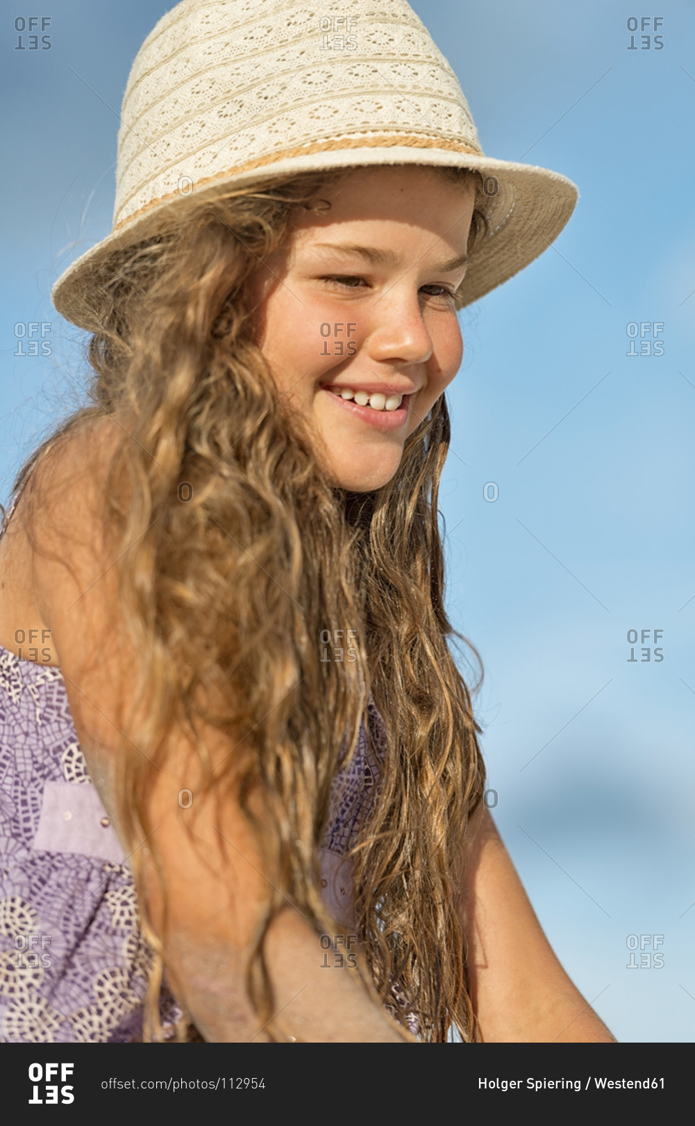 Smiling girl wearing summer hat