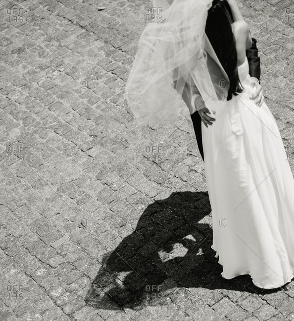 Newlyweds dancing outdoors