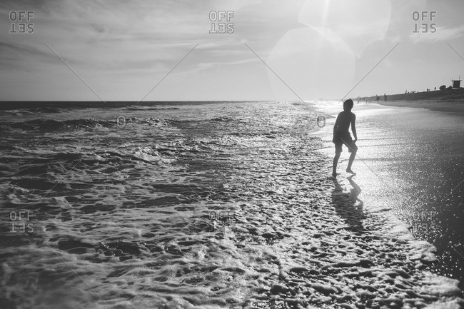 Boy standing on the beach