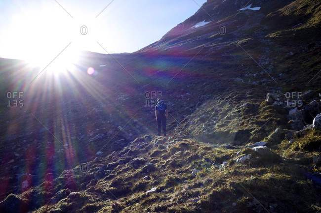 Man walking on mountain path