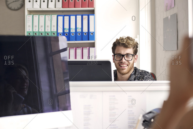 Man smiling in an office