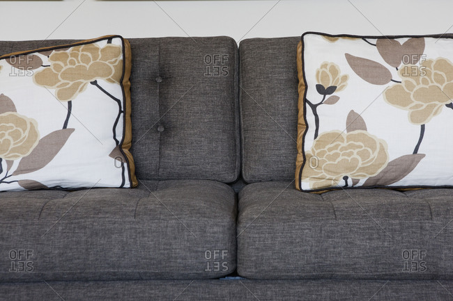 Floral patterned cushions on sofa in living room