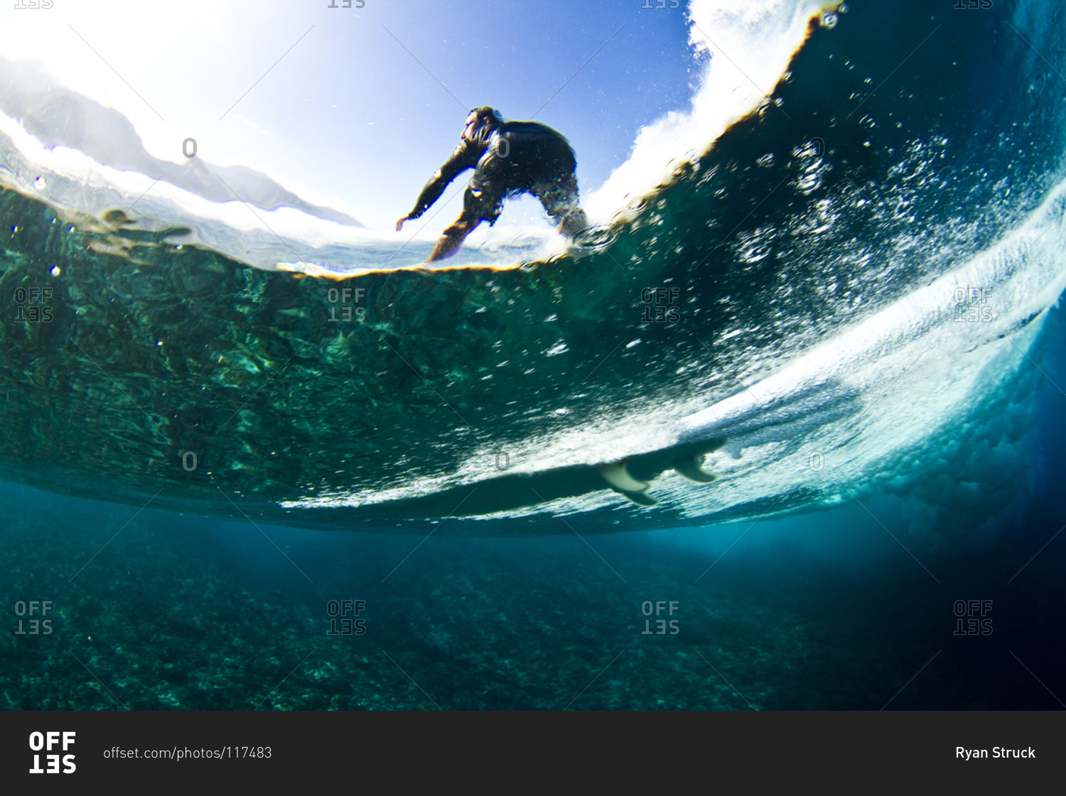 Surfing man in Tahiti