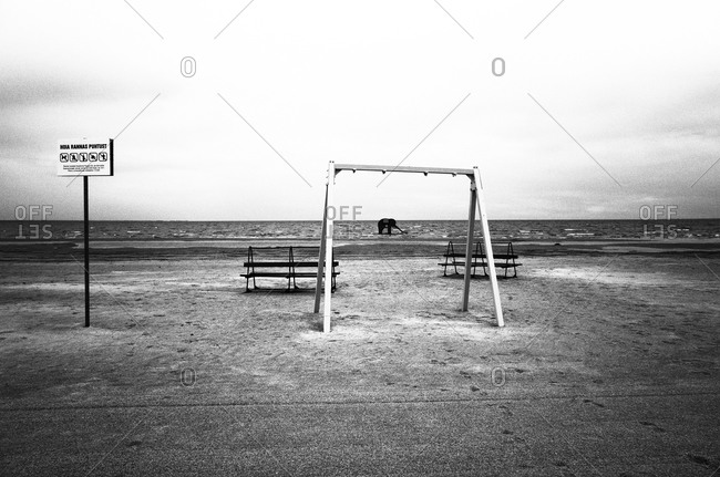 Empty swing on a sandy beach in Estonia