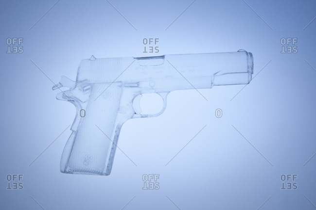 X-ray of a gun on blue background