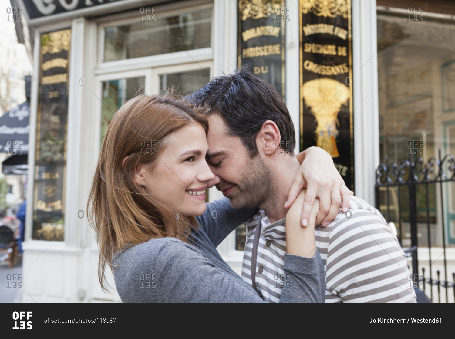 Couple in love in front of pastry shop