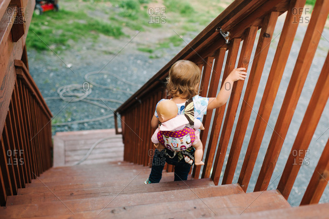 Toddler walking down outdoor steps