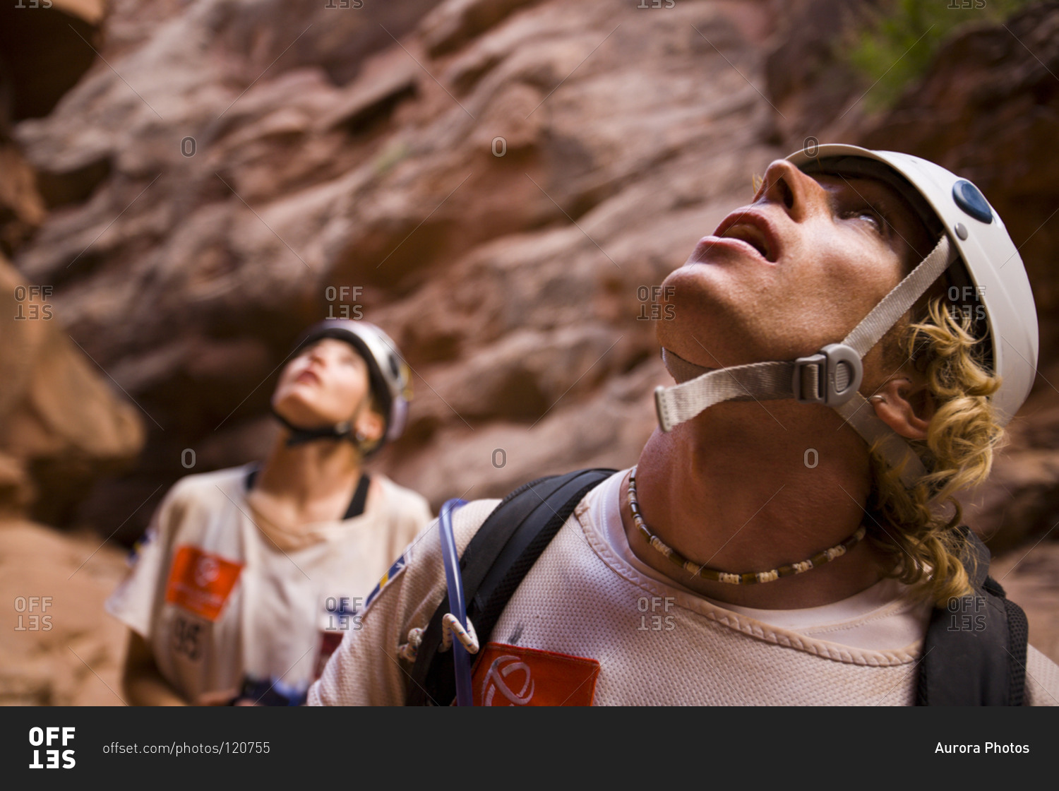 Adventure racers looking up from a canyon after rappelling in a race in Moab Utah.