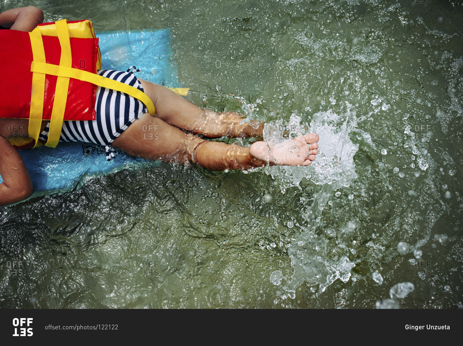 Girl swimming with a swimming float