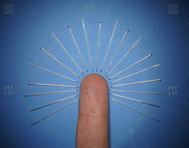 Needles around index finger