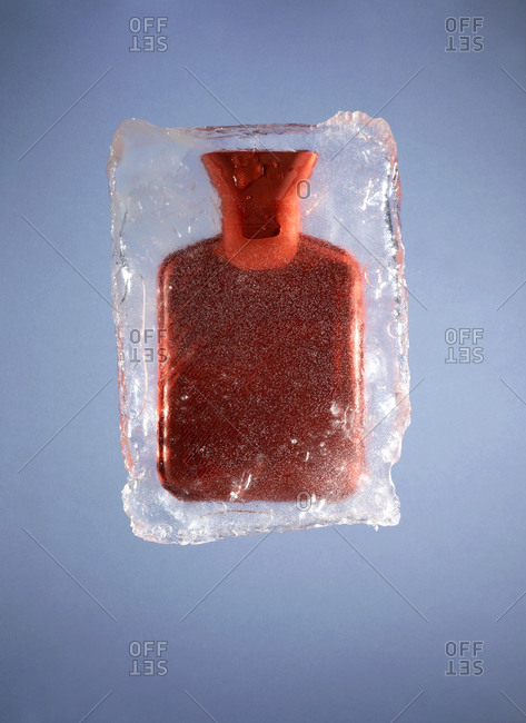 Hot water bottle frozen in ice