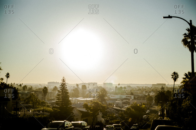 Glaring sun above a suburban neighborhood in California