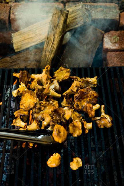 Close up of grilling freshly cut golden chanterelle