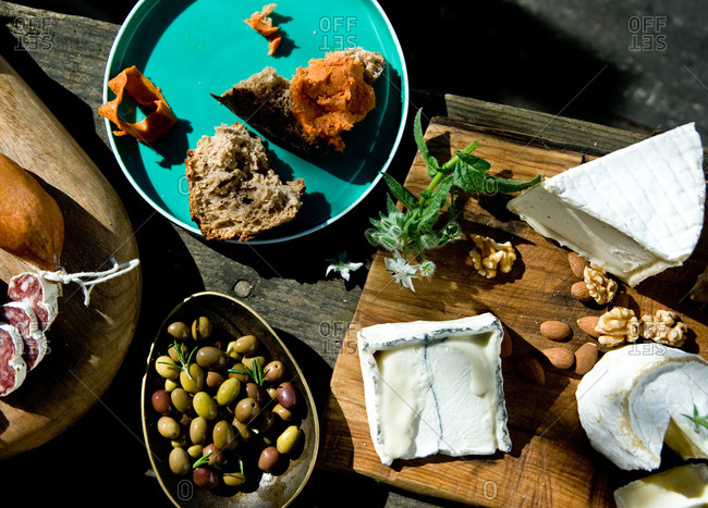 Three kind of organic cheese with olives and bread