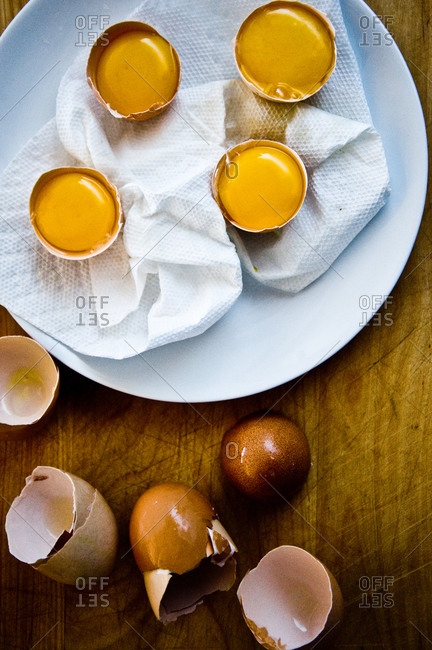 Top view of egg yolks in shells for poaching