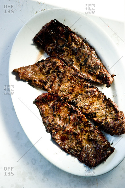 Grilled skirt steak served on a plate