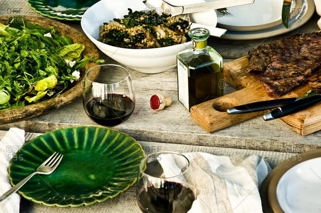 Grilled skirt steak and salad served at a dinner party
