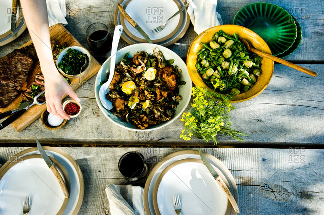 Person serving food at a dinner party