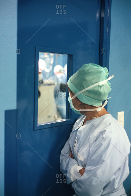 Female nurse observing a surgical operation