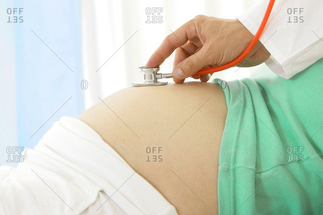 Auscultation of a pregnant woman
