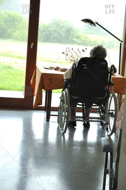 Rare view of an elderly lady in a wheelchair at a nursing home.