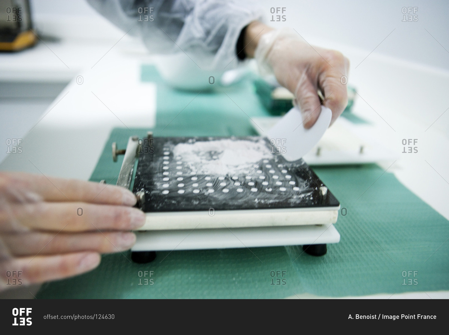 Laboratory technician preparing medical drugs using a measuring devise