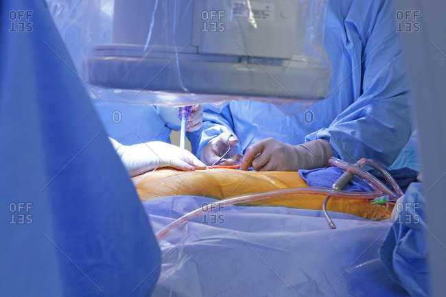 Surgeon performing a heart valve proth implantation.