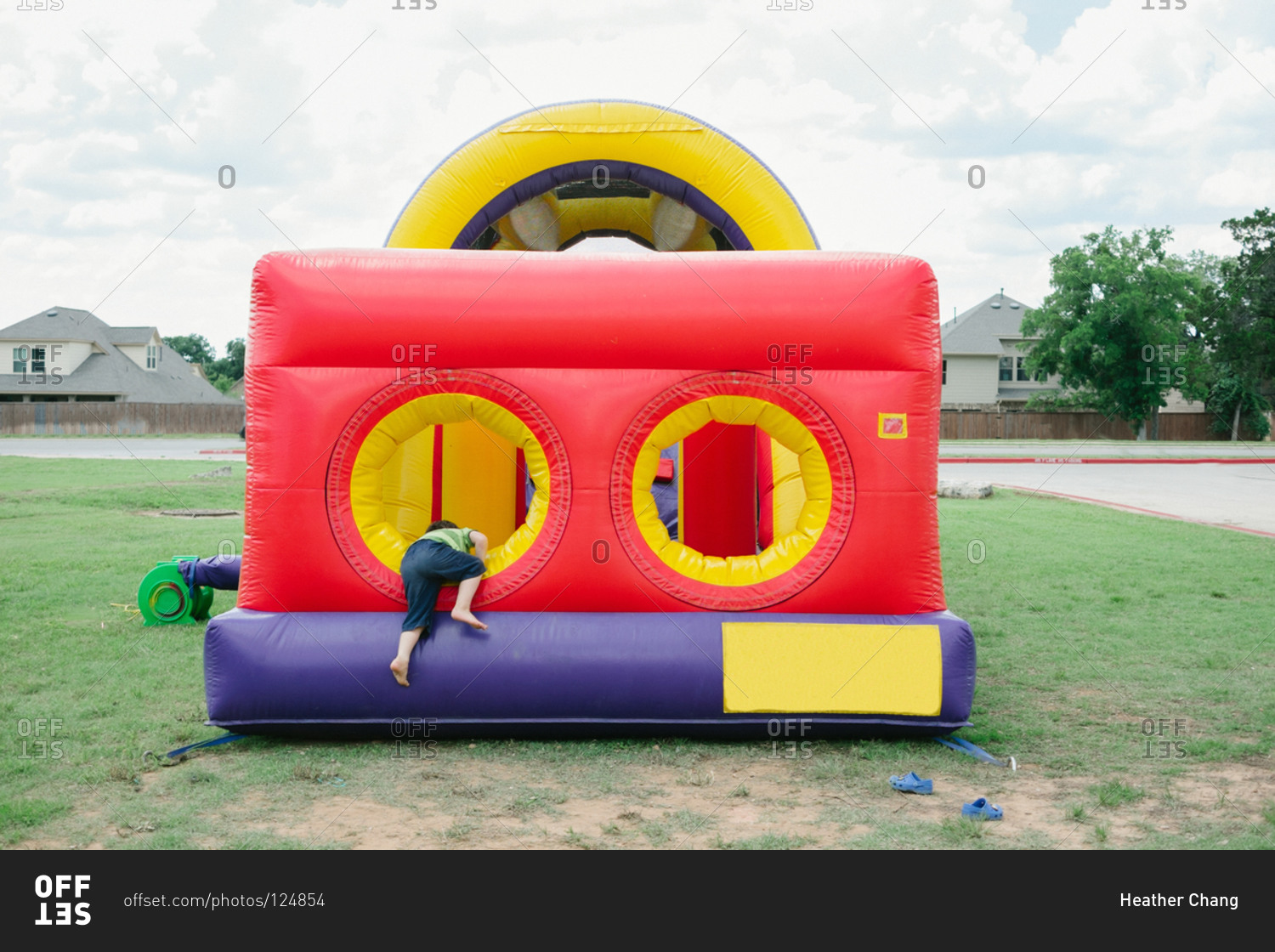 Boy climbing in a bouncy castle