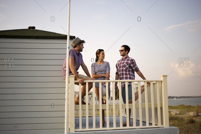 Friends talking on a balcony