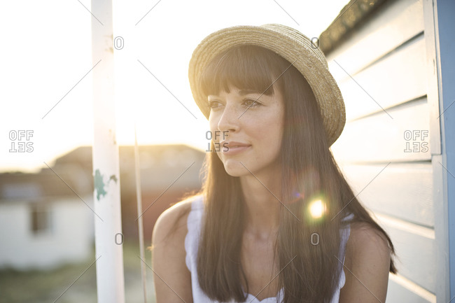 Portrait of a brunette woman in hat