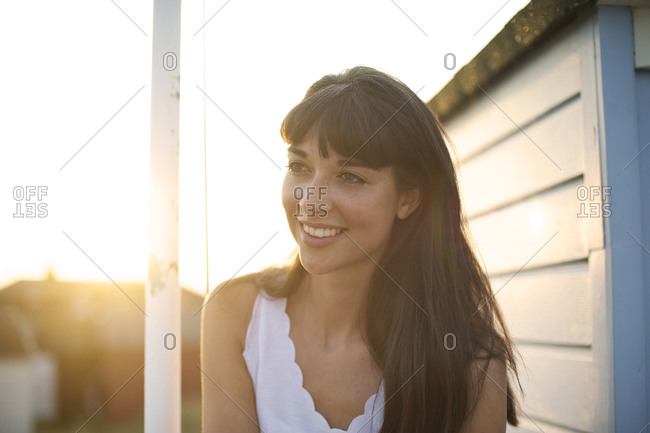 Portrait of a brunette woman at sunset