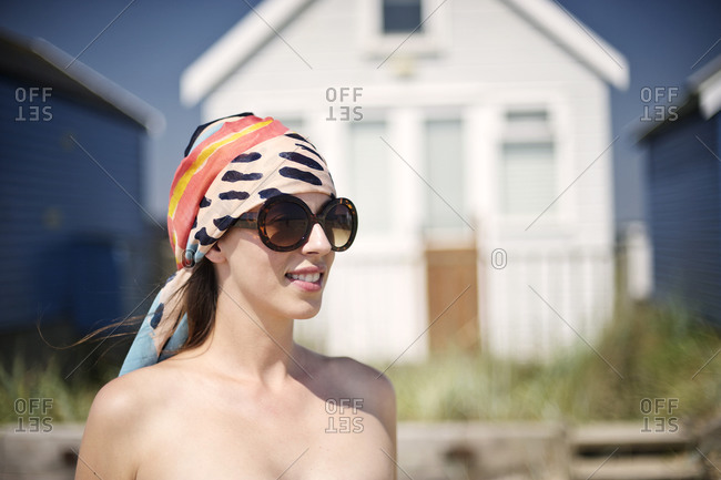 Portrait of a young girl in front of beach house