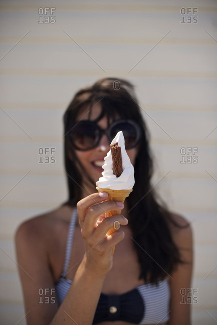 Brunette girl holding swirl ice cream