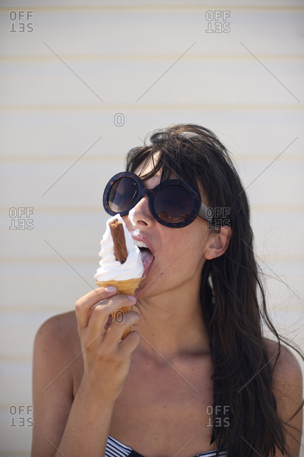 Brunette girl eating swirl ice cream