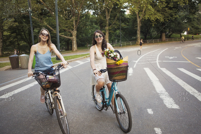 Two girls shop on bike