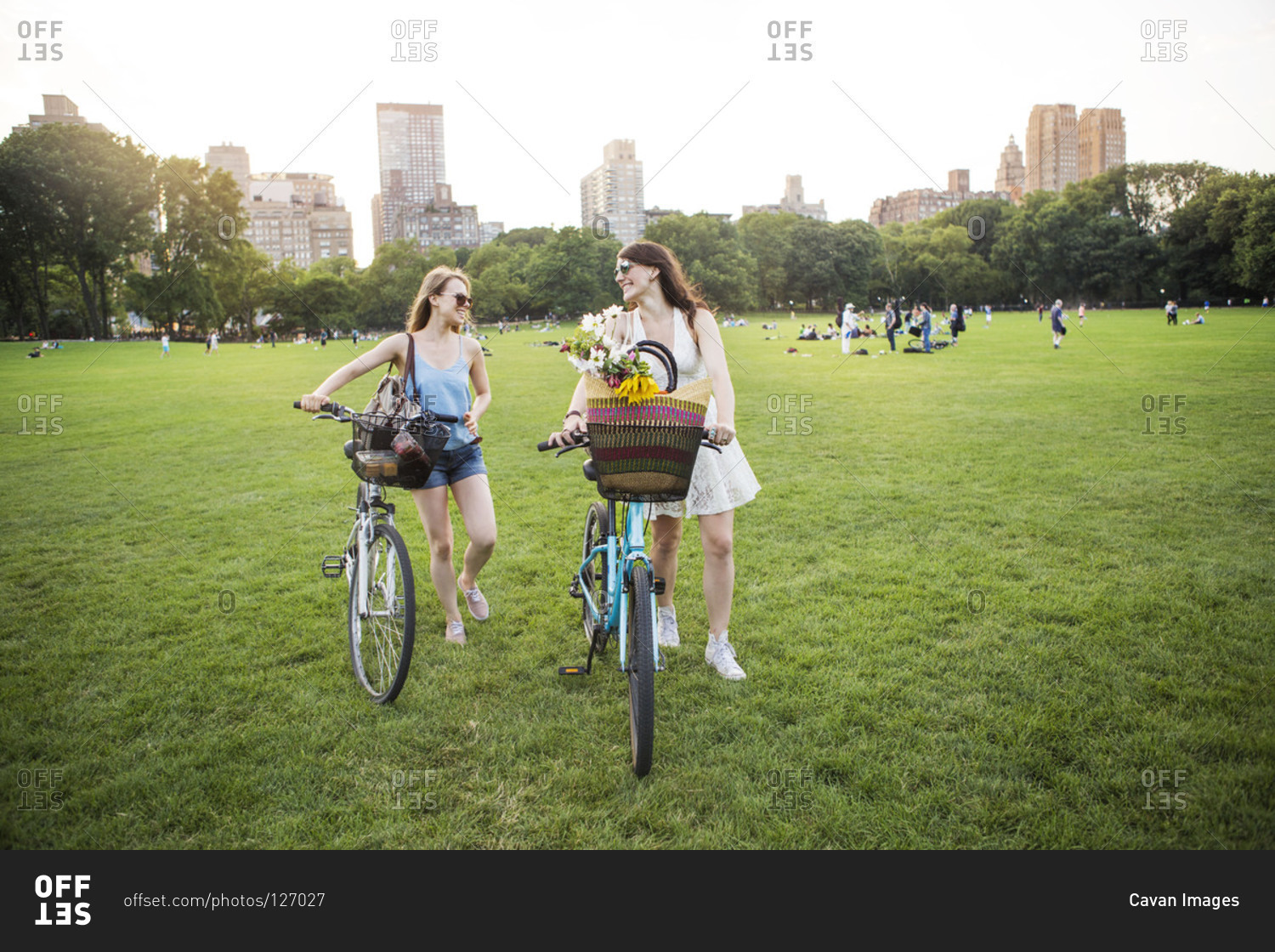 Same-sex couple pushing their bikes in Central Park