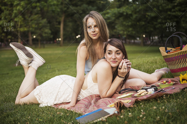 Same-sex couple lying in the grass in Central Park