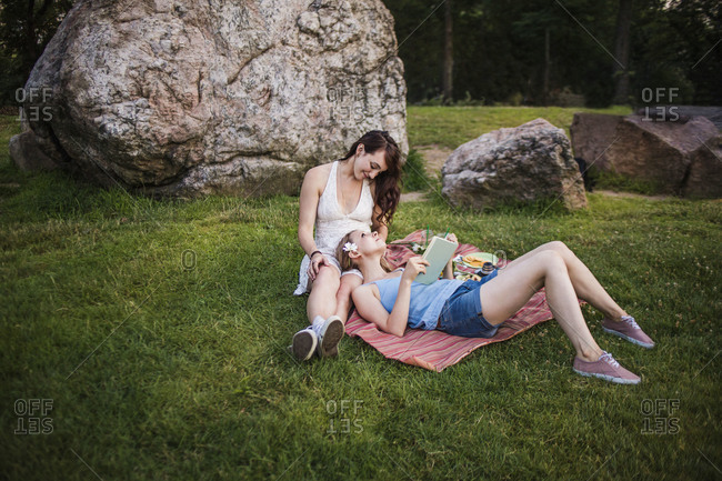 Same-sex couple relaxing in Central Park