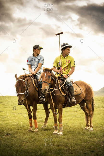 Mongolia - July 14, 2013: Mongolian polo players on horseback