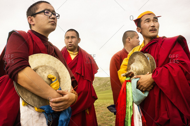 Mongolia - July 16, 2013: Three quarter length of monks with cymbals