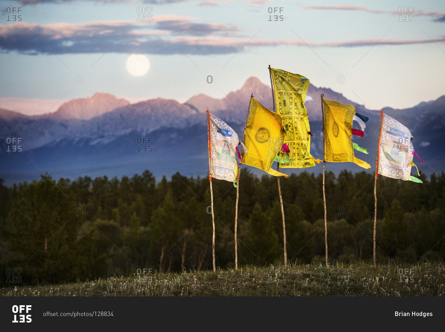 Prayer flags in Mongolia with full moon