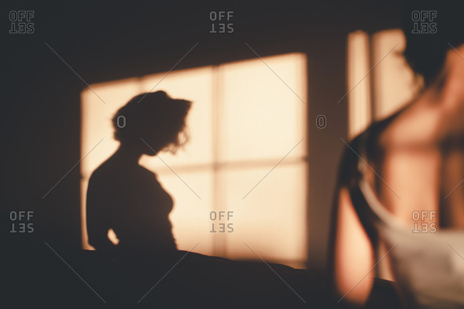 Shadow of a woman on a wall