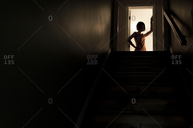 Woman standing in a doorway