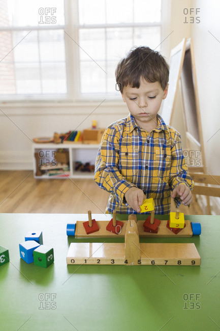 Boy playing with an educational toy