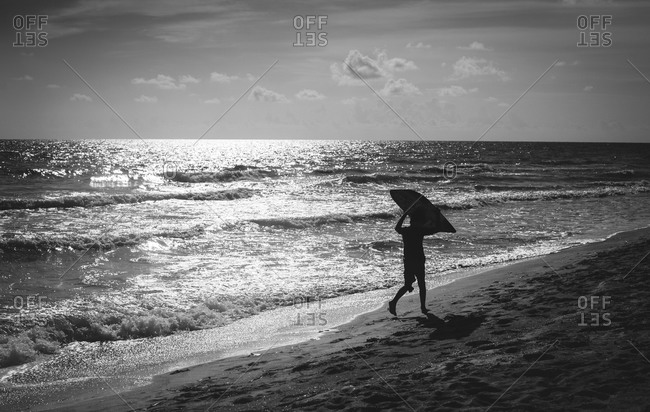 Person on beach with boogie board