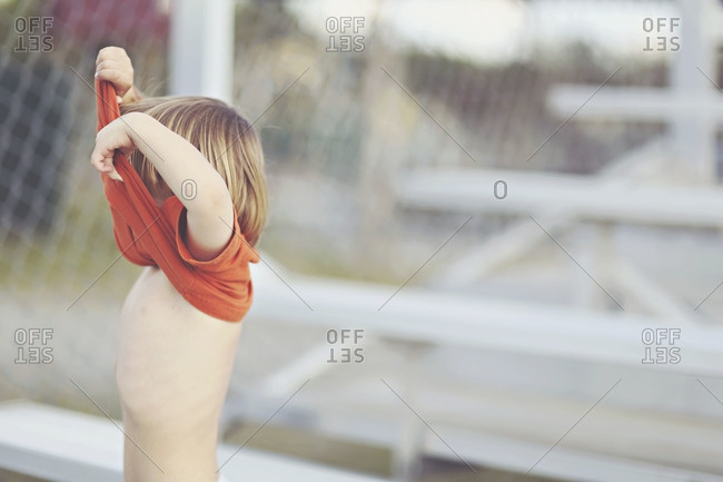 Boy taking clearance out girls clothes