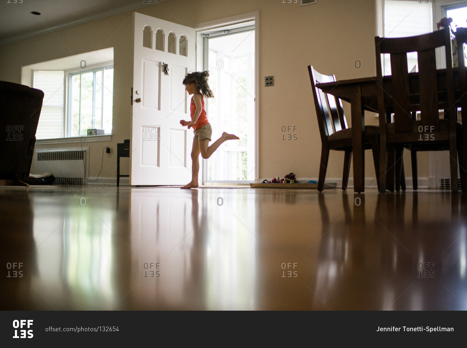 Low Angle Shot Of Girl Entering House Stock Photo Offset