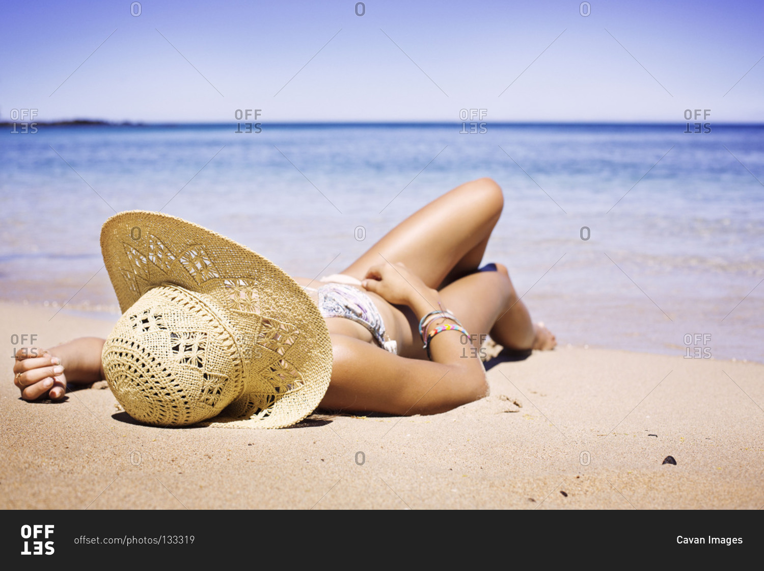 Woman sun-bathing on beach