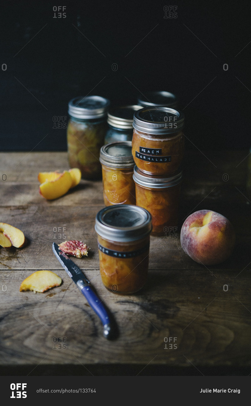 Jars of peach marmalade on cupboard