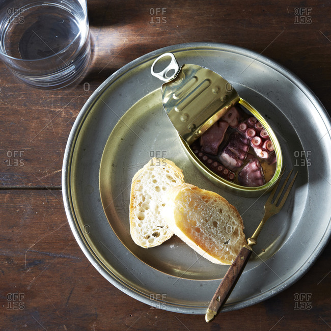 Canned octopus with baguette slices